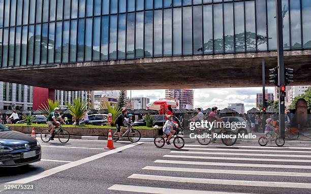 Several cyclists of different age in front of the MASP, Museum of Art of São Paulo, in Paulista Avenue. All sundays one track of avenue is exclusive...