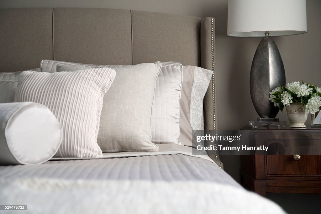 Neatly arranged pillows on a bed