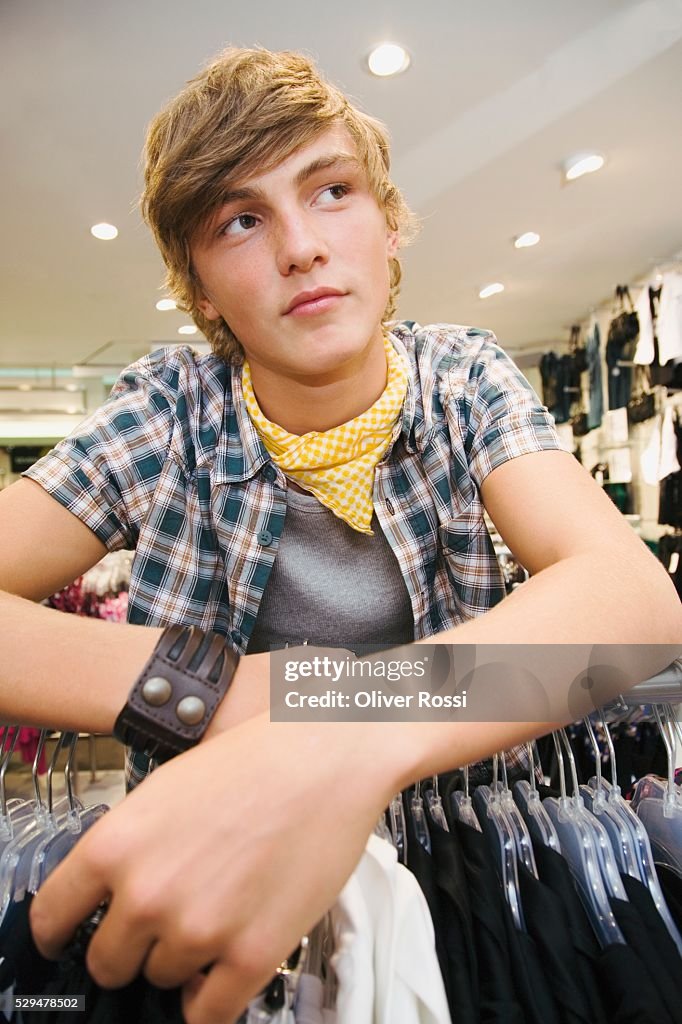 Teen boy in clothing store