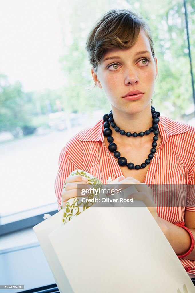 Teen girl holding shopping bag