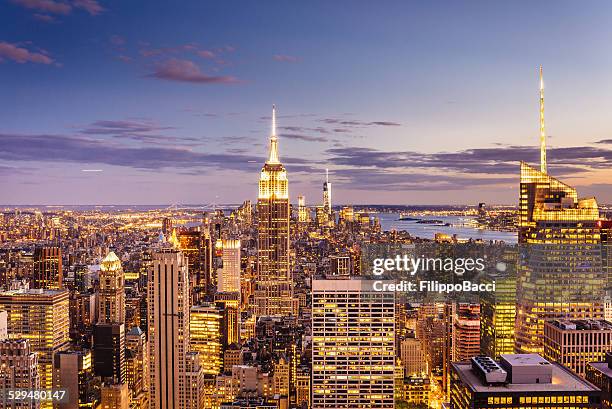 new york city skyline - midtown and empire state building - top of empire state building stock pictures, royalty-free photos & images