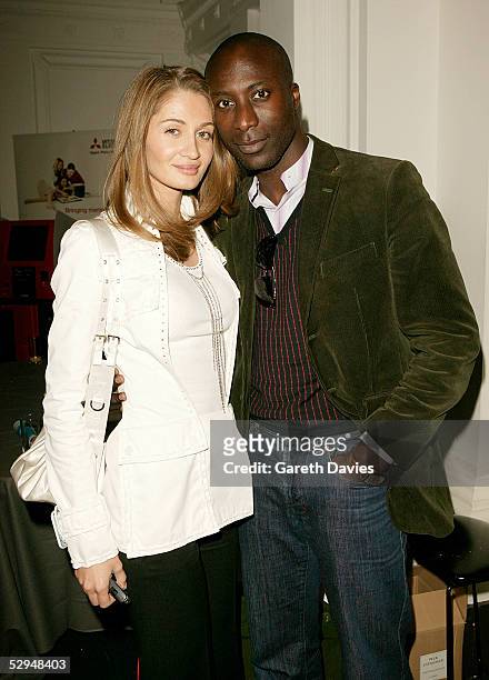 Designer Ozwald Boateng and his wife Gyunel Boateng attend attend the opening of Photo London at The Royal Academy May 18, 2005 in London. The...