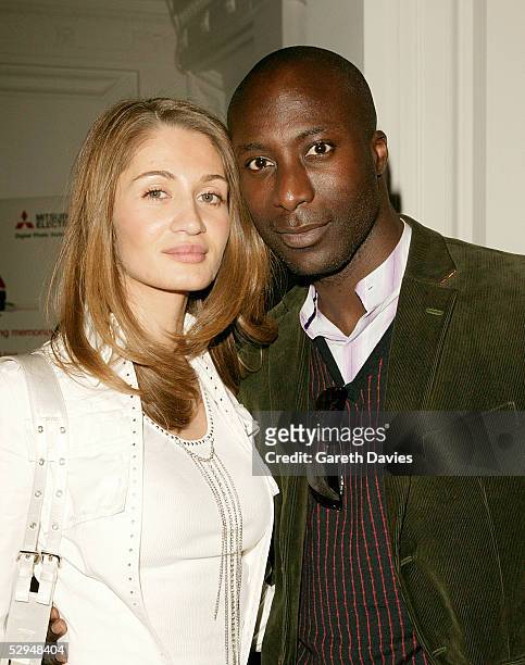 Designer Ozwald Boateng and his wife Gyunel Boateng attend the opening of Photo London at The Royal Academy May 18, 2005 in London. The exhibition...