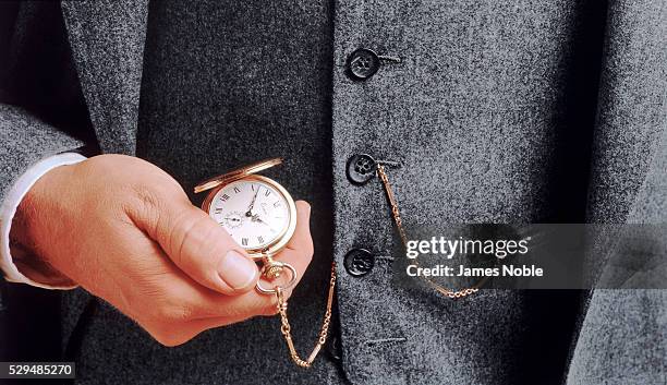 man checking his pocket watch - impatient stock pictures, royalty-free photos & images