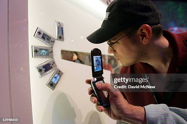 Mario Ortiz, of Everett, Washington, looks at the Nintendo Gameboy Micros at the 11th annual Electronic Entertainment Expo on May 18, 2005 in Los...