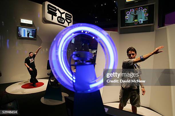 Adam Torres plays with the an EyeToy: Kinetic system, which is operated by body movements, at the 11th annual Electronic Entertainment Expo on May...