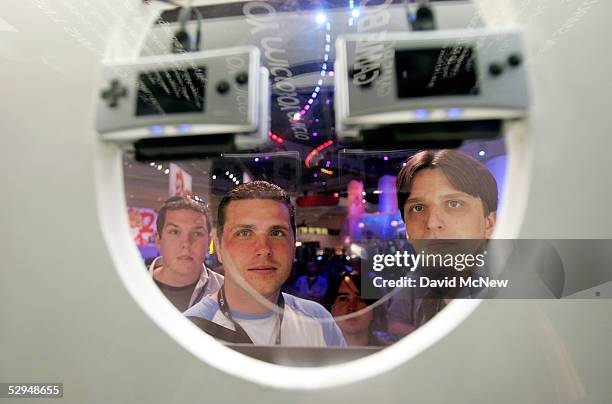 Vistors look at new Nintendo Gameboy Micro at the 11th annual Electronic Entertainment Expo on May 18, 2005 in Los Angeles, California. More than...