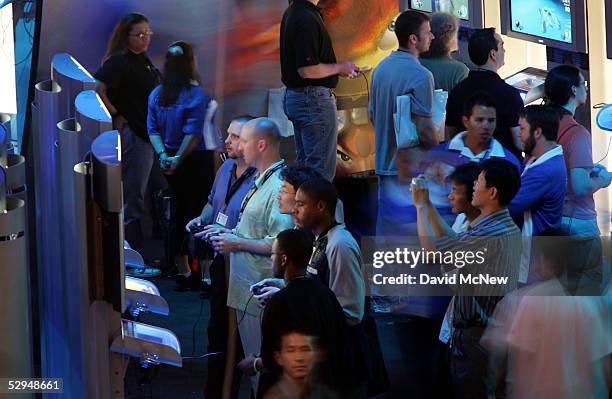 Gamers try out the latest games at the Playstation exhibit at 11th annual Electronic Entertainment Expo on May 18, 2005 in Los Angeles, California....