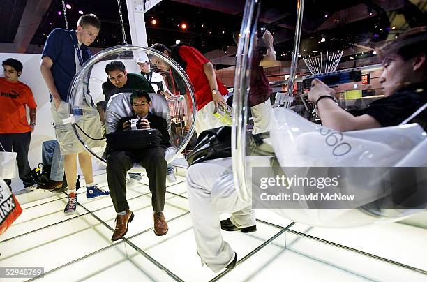 Gamers try out Sony PlayStation Portables at the 11th annual Electronic Entertainment Expo May 18, 2005 in Los Angeles, California. More than 1,000...