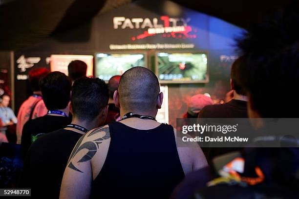 Vistors watch a presentation of the game "Fatality" at the 11th annual Electronic Entertainment Expo May 18, 2005 in Los Angeles, California. More...