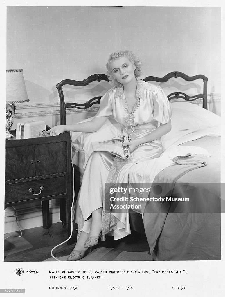 Actress Using an Electric Blanket