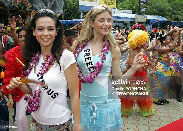 Miss Greece Evangelia Aravani and Miss Cyprus Helen Hatjidimetriuo upon arriving at the Phuket Fantasea on Phuket island, 19 May 2005 during a Miss...