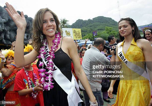 Miss Paraguay Universe 2005 Karina Buttner poses for a photo as she arrives with Miss India Universe 2005 Amrita Thapar at Phuket Fantasea theme park...