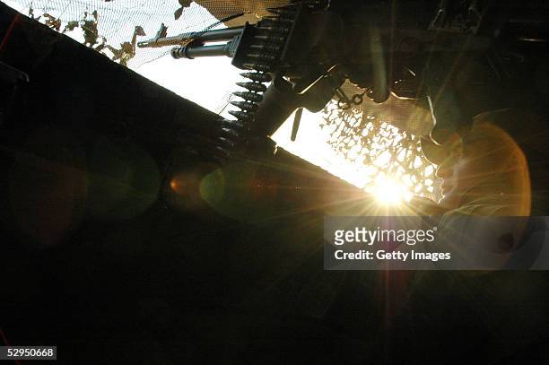 An Israeli Defense Forces solider looks out of an outpost as the sun sets May 17, 2005 in Rafa, Gaza strip. Tension has grown since ongoing...