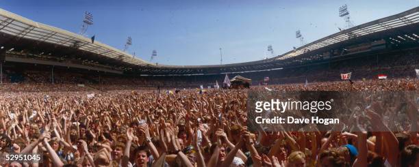 Sea of arms applauding as the crowd at the Live Aid Concert enjoy the show at Wembley Stadium, 13th July 1985.