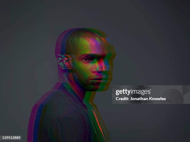 multiple exposure,portrait of a dark skinned male - same person different looks - fotografias e filmes do acervo