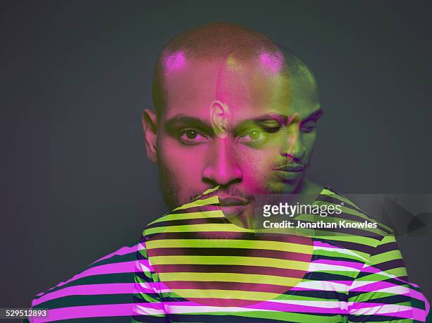 multiple exposure of a dark skinned male - digital composite stock-fotos und bilder