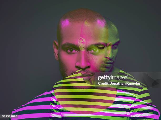 multiple exposure of a dark skinned male - schizophrenia stock pictures, royalty-free photos & images