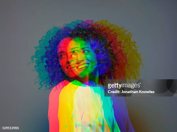 multiple exposure,dark skinned female smiling - digital composite stock-fotos und bilder