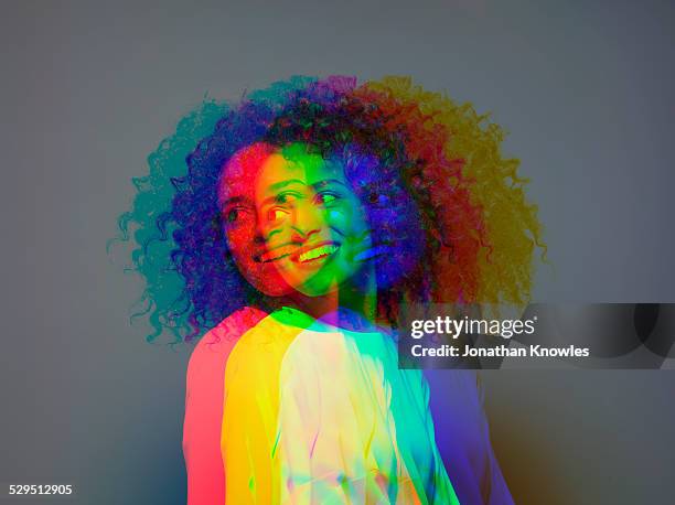 multiple exposure,dark skinned female smiling - alleen jonge vrouwen stockfoto's en -beelden