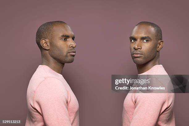 twin image, dark skinned male - same person different looks - fotografias e filmes do acervo