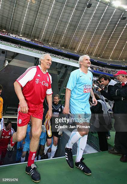 Rudi Voeller and Franz Roth run out onto the pitch for the opening match of the Allianz-Arena on May 19, 2005 in Munich Germany. Former payers of the...