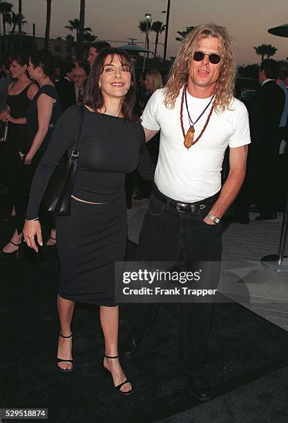 Marina Sirtis and her husband Michael Lampert arrive.