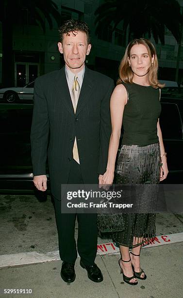 Lyle Lovett and girlfriend April Kimble arrive.