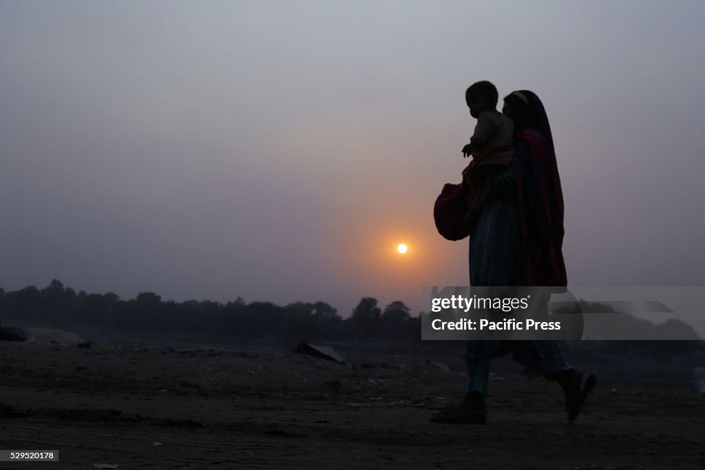 Pakistani mother is playing and expressing affection to her child on ...