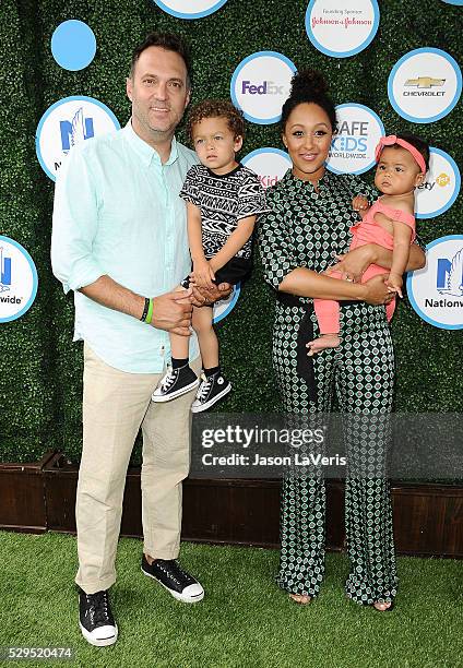 Adam Housley, Aden John Tanner Housley, Tamera Mowry and Ariah Talea Housley attend Safe Kids Day at Smashbox Studios on April 24, 2016 in Culver...