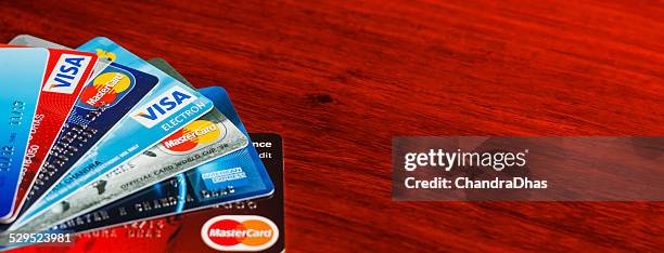 payment solutions - credit and debit cards - american express shop stock pictures, royalty-free photos & images