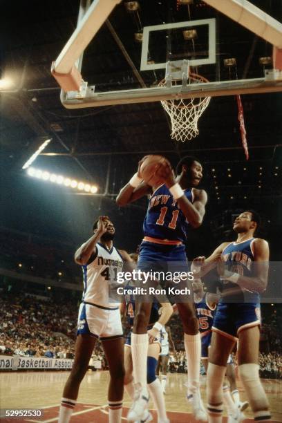 Bob McAdoo of the New York Knicks grabs a rebound against the the Denver Nuggets at McNichols Sports Arena circa 1979 in Denver, Colorado. NOTE TO...