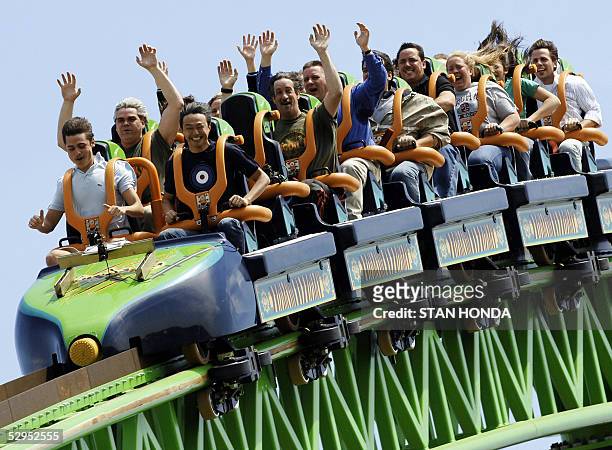 Riders raise their arms as they travel the "Kingda Ka" roller coaster 19 May at Six Flags amusement park in Jackson, New Jersey. The roller coaster...