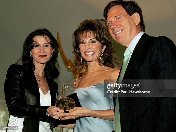 Actress Susan Lucci is honored by Katherine Oliver of the Mayor's Office of Film and Peter Price, President of the National Television Academy during...