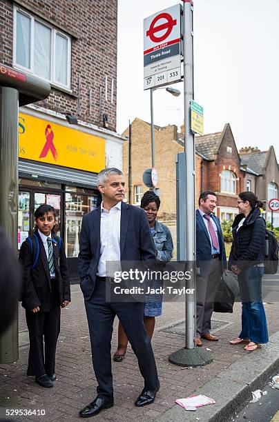 London Mayor Sadiq Khan waits at a bus stop after leaving his home in Tooting on May 9, 2016 in London, England. Mr Khan begins his first day at his...