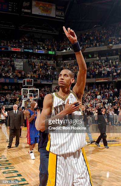 Reggie Miller of the Indiana Pacers salutes the fans as he walks off the floor following his final NBA career game in Game six of the Eastern...