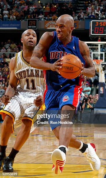 Chauncey Billups of the Detroit Pistons drives past Jamaal Tinsley of the Indiana Pacers in Game six of the Eastern Conference Semifinals during the...