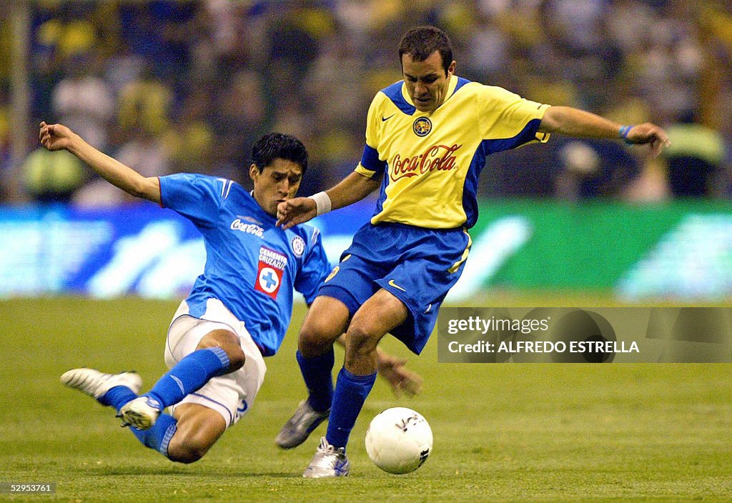 Cuauhtemoc Blanco (R) of America fights