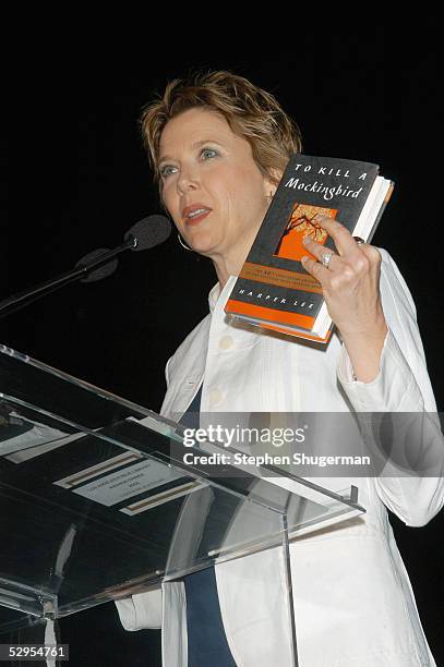 Actress Annette Bening holds a copy of Harper Lee's book "To Kill A Mockingbird" while speaking at the Library Foundation of Los Angeles 2005 Awards...