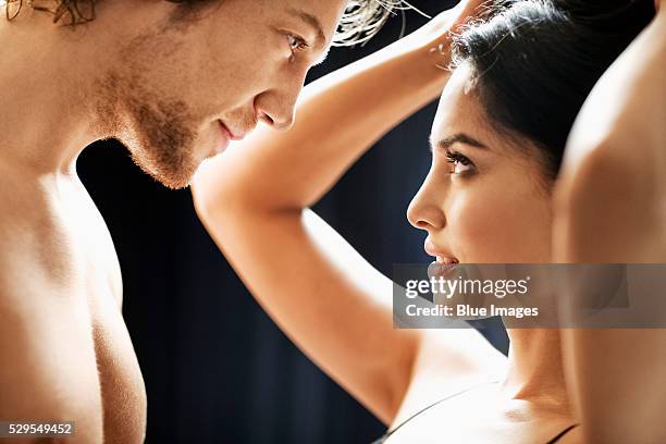 couple looking into each other's eyes - seduzione foto e immagini stock