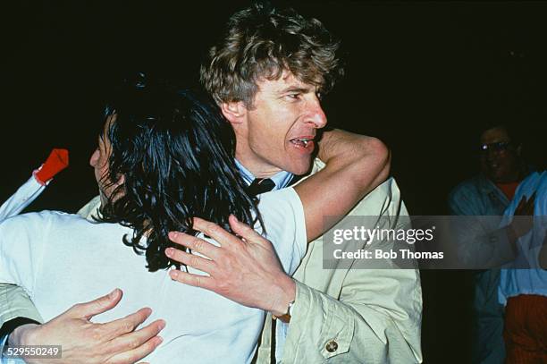 French footballer Marcel Dib , of AS Monaco, is embraced by Monaco manager Arsene Wenger at a European Cup Winners Cup, Semi-Final, 2nd Leg match...