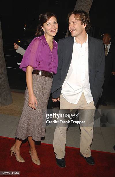 Maggie Gyllenhaal and date arriving at the premiere of "Moonlight Mile".