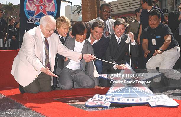 Johnny Grant , Owen Wilson, Brett Ratner and Leron Grubler gather around Jackie Chan at the ceremony where Chan received a star on The Hollywood Walk...