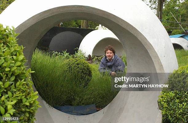 Irish Tv personality garden designer Diarmuid Gavin with part of his display at RHS Chelsea Flower Show , 20 May 2005. The Royal Horticulteral Show,...