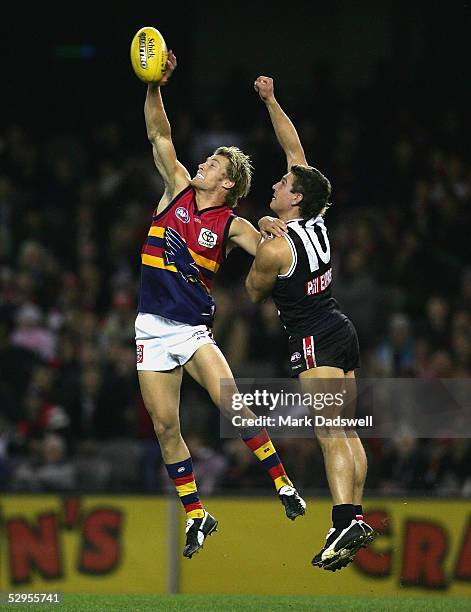 Scott Thompson for the Crows contests a mark with Steven Baker for the Saints during the AFL Round 9 match between the St Kilda Saints and the...