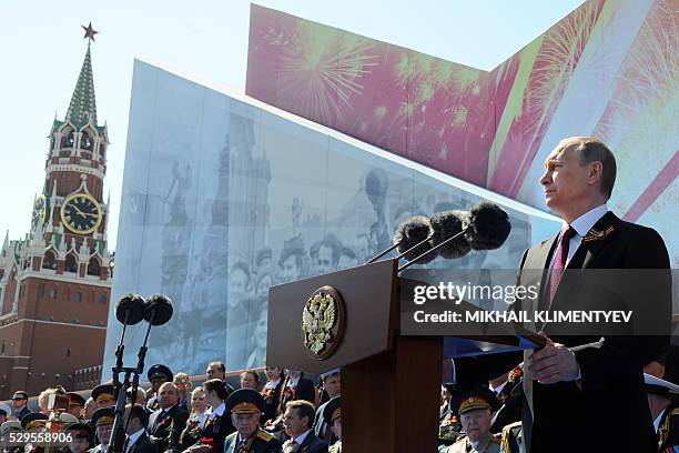 Russian President Vladimir Putin delivers a speech during the Victory Day military parade at Red Square in Moscow on May 9, 2016. Russia marks the...