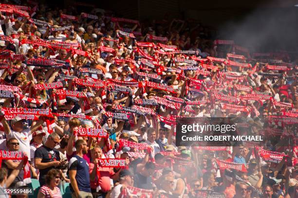 Leipzig's fans cheer duringthe German second division Bundesliga football match between RB Leipzig and Karlsruher SC at the Red Bull Arena in...