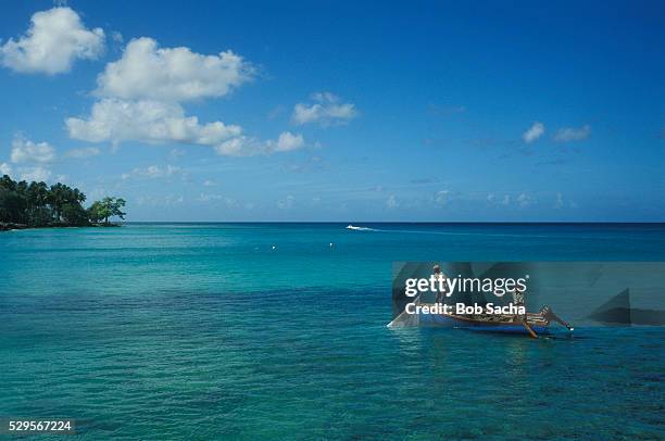 fishing off speightstown - barbados stock pictures, royalty-free photos & images