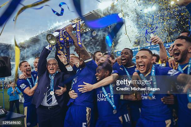 Captain Wes Morgan and manager Claudio Ranieri of Leicester City lift the Premier League Trophy after the Barclays Premier League match between...