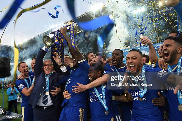 Captain Wes Morgan and manager Claudio Ranieri of Leicester City lift the Premier League Trophy after the Barclays Premier League match between...